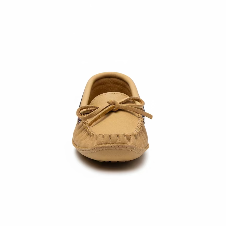 Tan moccasin shoe on a white background