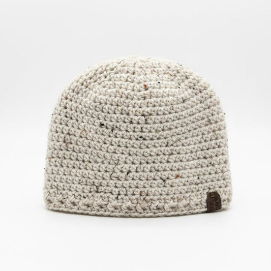 Beige crocheted beanie on a white background