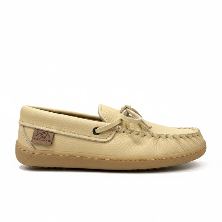 Beige moccasin shoe on a white background