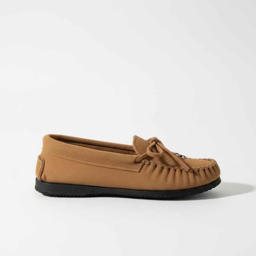 Brown moccasin shoe on a white surface