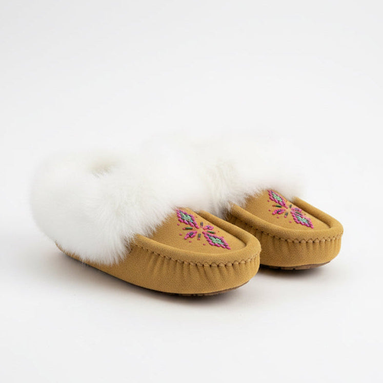 Pair of tan slippers with white fur lining on a white background