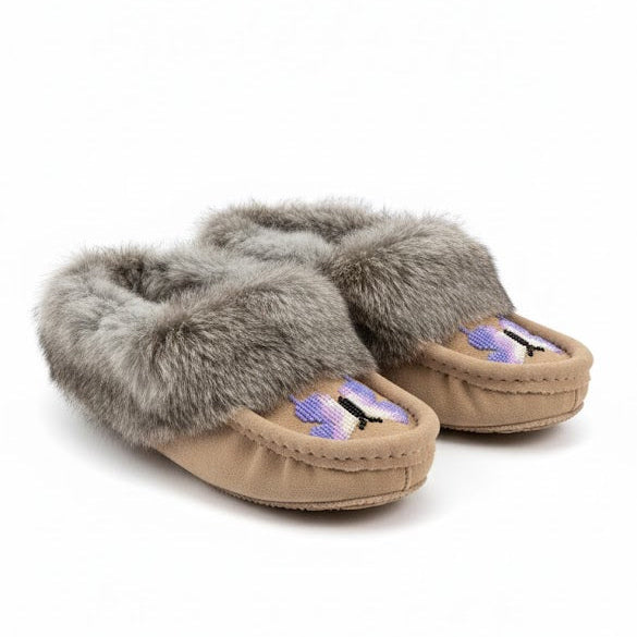 Pair of slippers with fur trim on a white background
