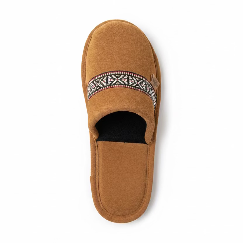 Brown slipper with decorative strap on a white surface