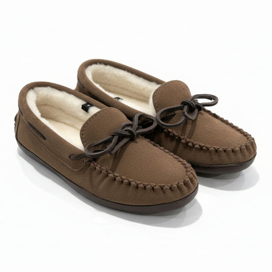 Brown moccasin slippers with fur lining on a light surface