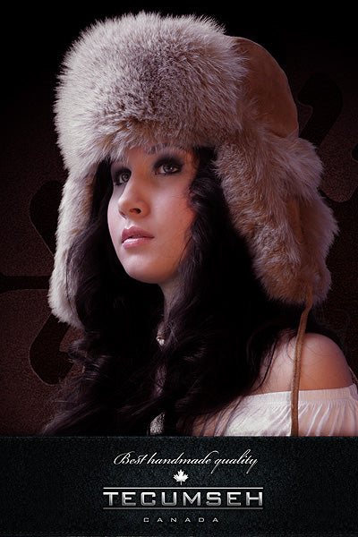 Woman wearing a fur hat with 'Tecumseh Canada' branding on a dark background