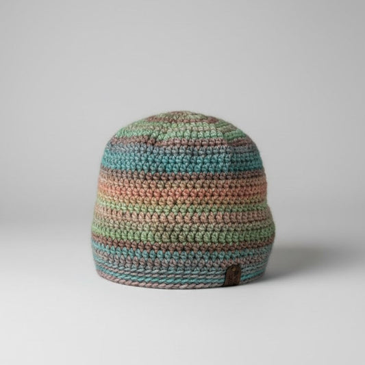 Multicolored striped beanie on a gray background