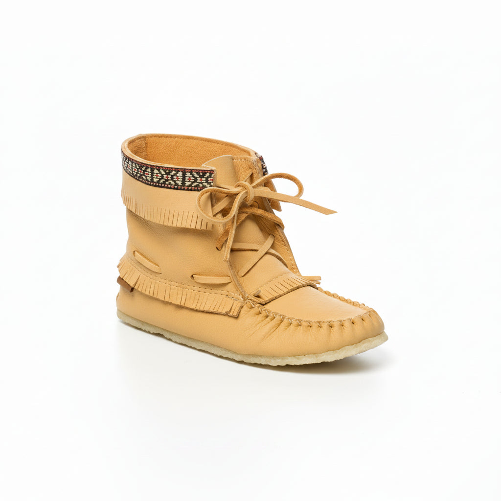 Tan moccasin boot with fringes on a white background