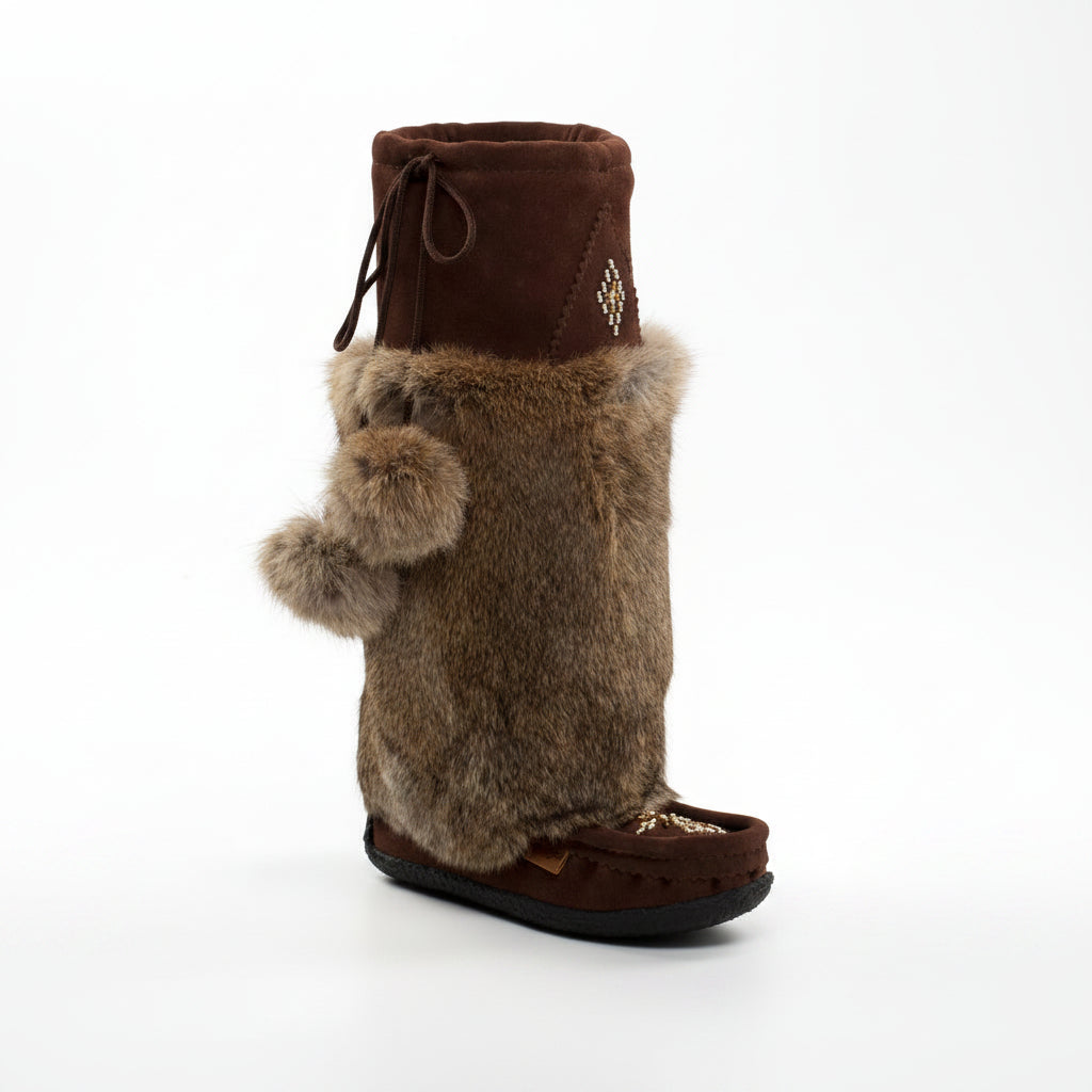 Brown fuzzy boot with a decorative top on a white background