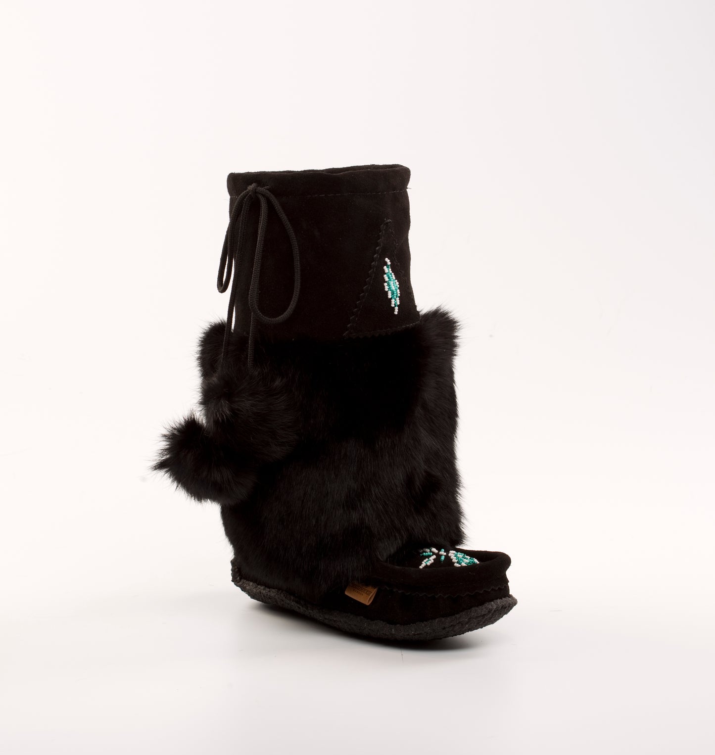 Black mukluk boot with fur trim on a white background