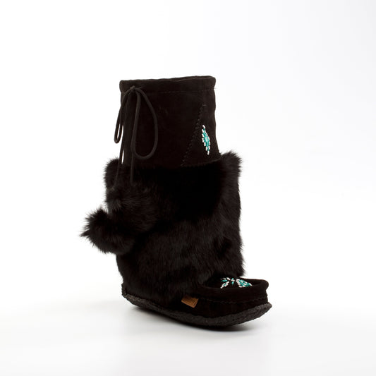 Black mukluk boot with fur trim on a white background