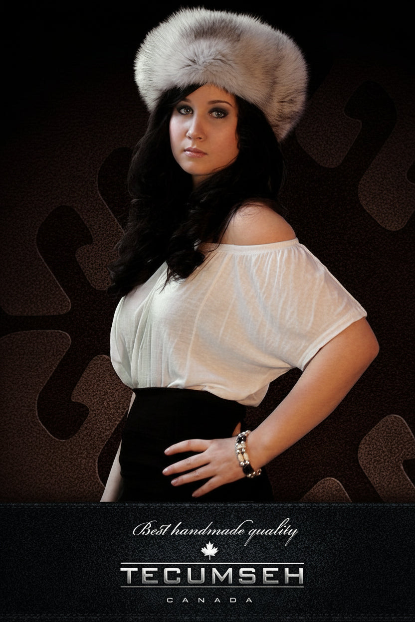Woman wearing a white off-shoulder top and fur hat against a dark background with 'Tecumseh Canada' branding.