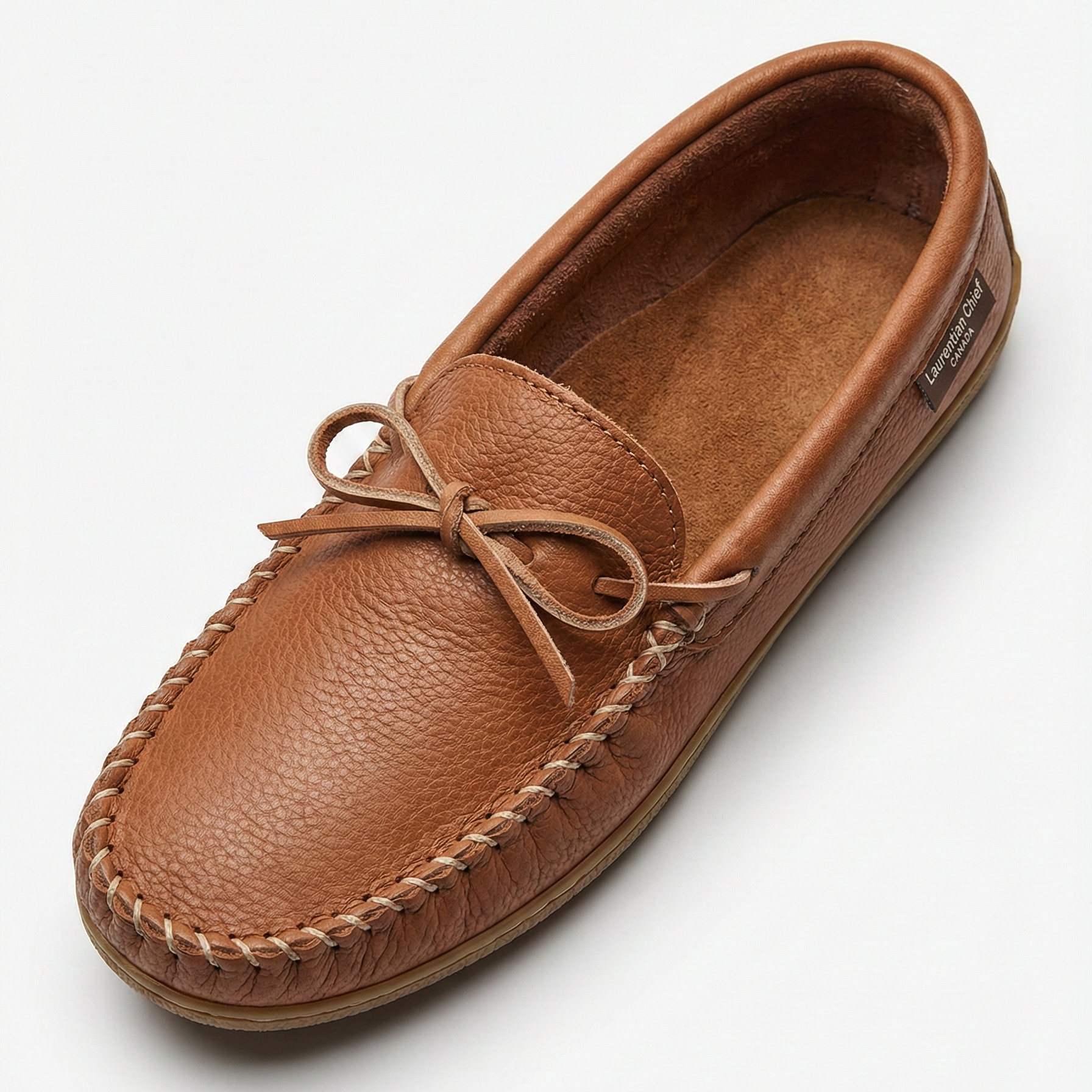 Brown leather moccasin shoe on a white background
