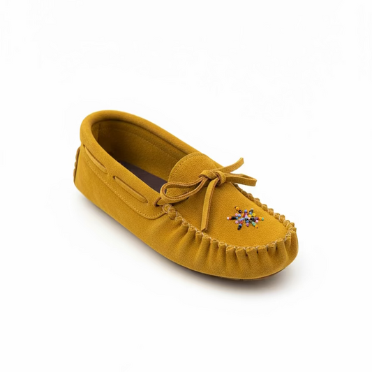 Yellow moccasin shoe with a decorative bow on a white background