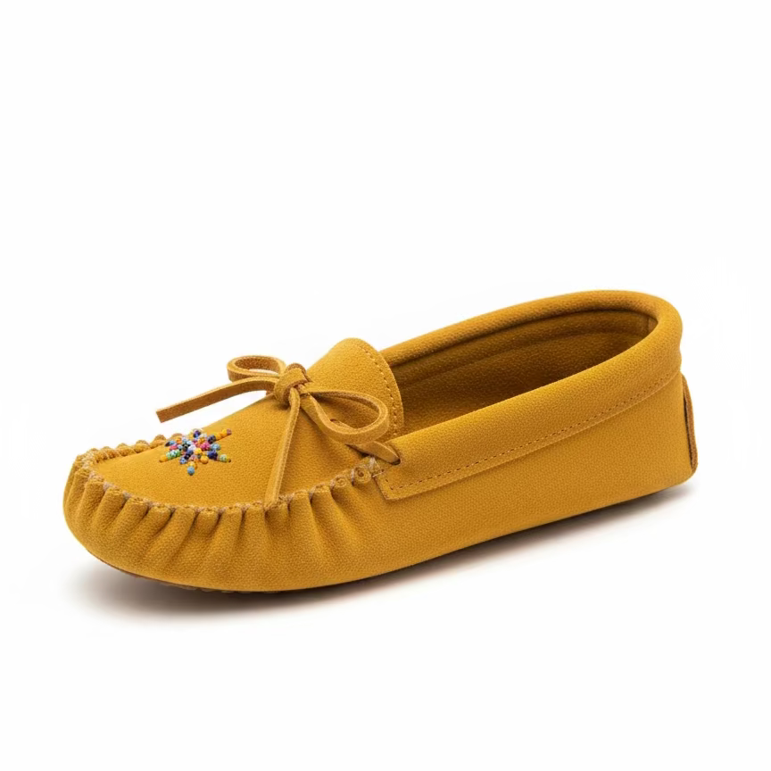 Yellow moccasin shoe with a decorative bow on a white background