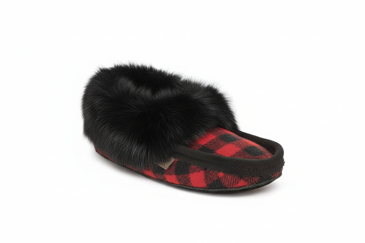 Slipper with black fur trim and red plaid pattern on a white background