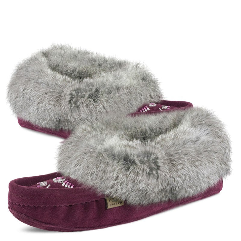 Pair of slippers with gray fuzzy top and purple sole on a white background