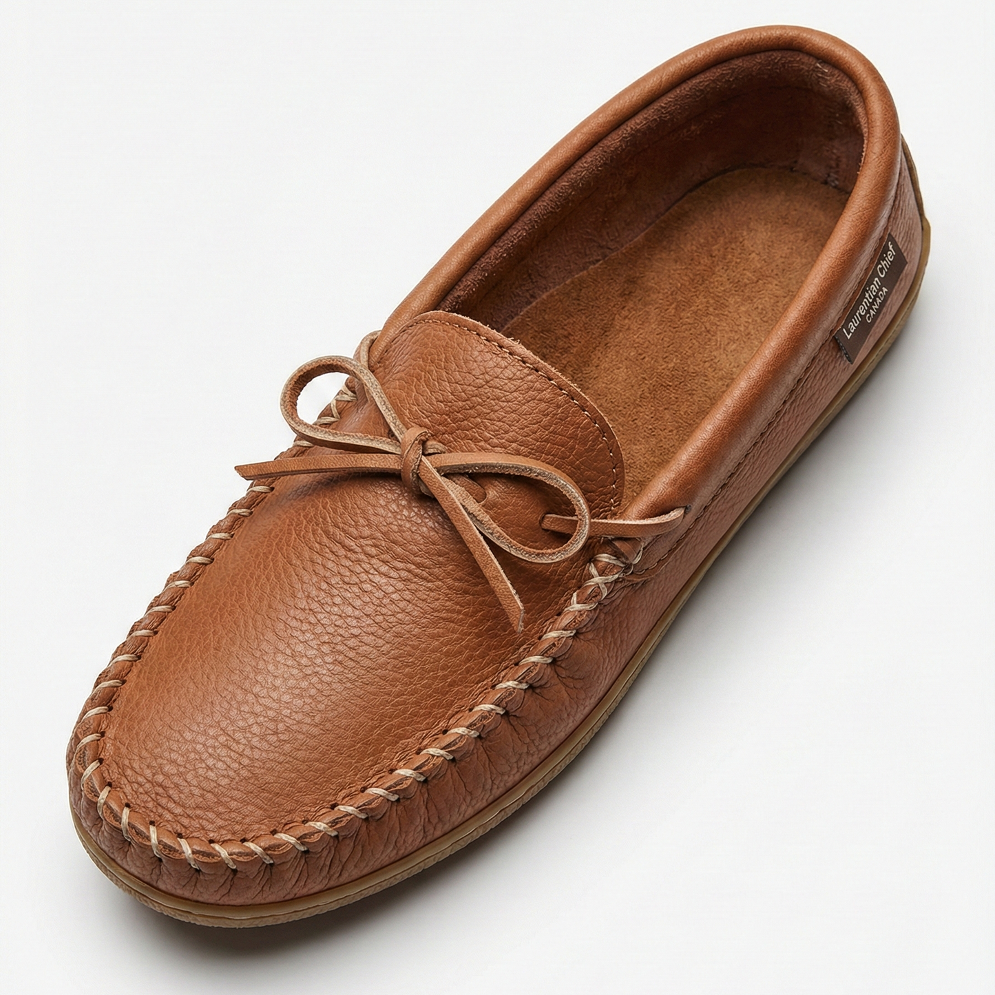 Brown leather moccasin shoe on a white background