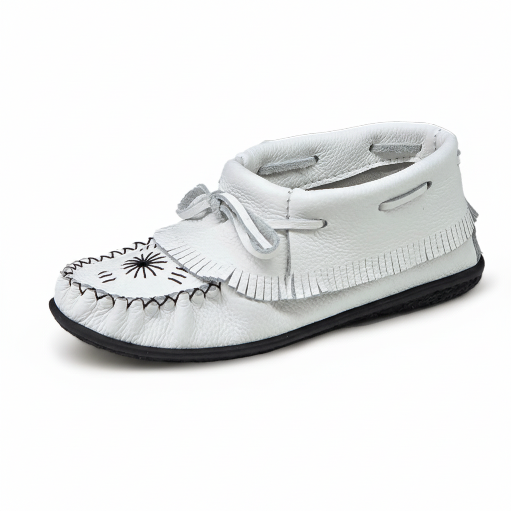 White moccasin shoe with black details on a white background
