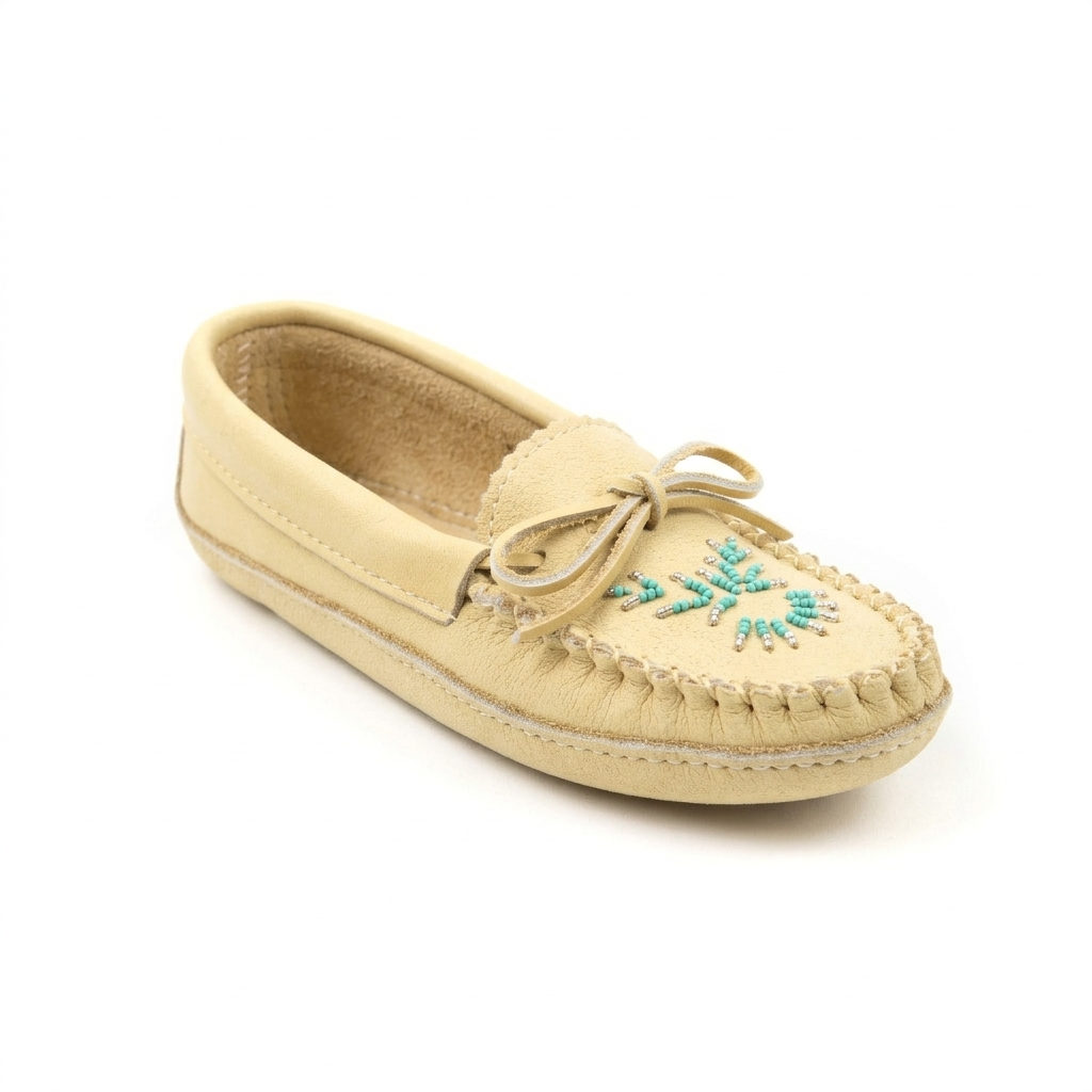 Beige moccasin shoe with turquoise bead design on a white background