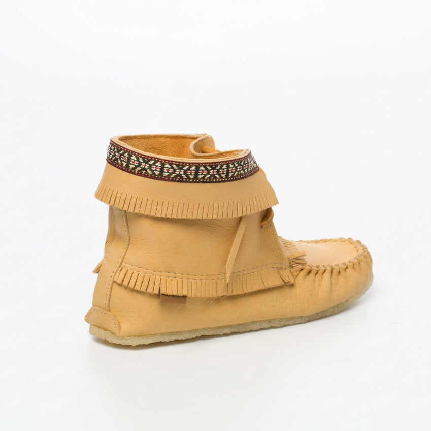 Tan moccasin shoe with decorative band on a white background